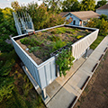 Green roof lawn accessed from the second floor of a modern house. Photo by Allison H. Anderson.
